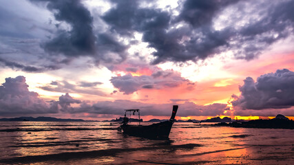 Fototapeta na wymiar Beautiful sunset with fishing boat , Krabi Thailand
