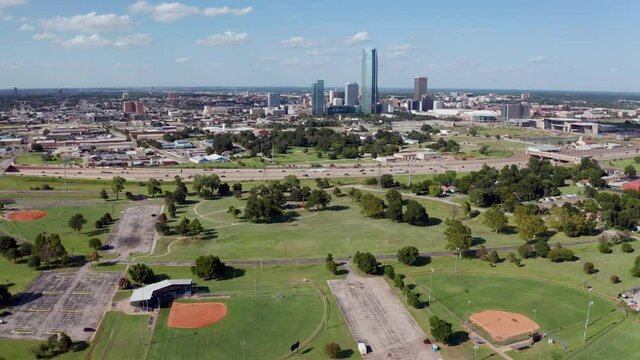 Aerial perspective flying into the urban expanse of downtown Oklahoma City  United States