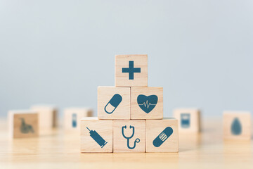 Wood block stacking with icon healthcare medical, Insurance for your health concept