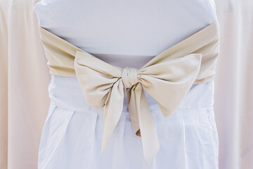 Close up of chair decoration with beige bun