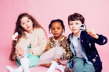 lifestyle people concept: diverse nation children playing together, boy and girl, caucasian and african american