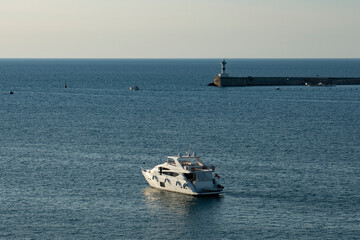 Obraz premium Motor yacht in the sea bay.