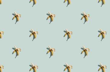Trendy sunlight Summer pattern made with banana on blue background