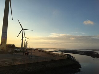 wind turbines in the sunset