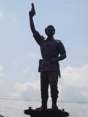 A hero statue on the main street of town