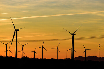 Silhouette of Windmills at dusk in Palm Springs, California, USA.