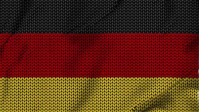 German waving flag in knitting background for the winter season