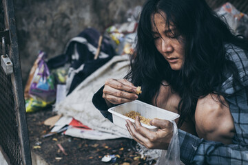 poor people,homeless or beggar begging for help sitting at dirty slum.concept for poverty...