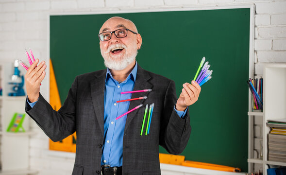 Too Much. Happy Bearded School Teacher. Back To School. Classroom With Blackboard. School Writing Items Shopping. Man Use Many Office Tools. Senior Teacher Hold Colorful Pen Set. Choose Any Color