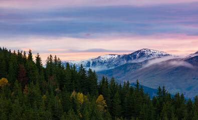 Naklejka na ściany i meble Beautiful October sunset in the mountains