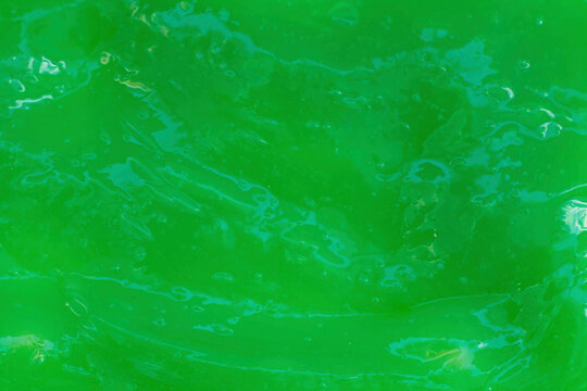 The texture of green slime. Design for halloween. The photo - Powered by Adobe
