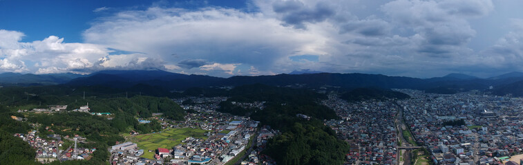 Fototapeta na wymiar 航空撮影した夏の高山市の街並みのパノラマ風景