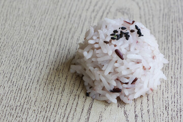 Fototapeta na wymiar Close up mix of steam jasmine rice and berry rice.