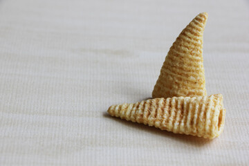 Cone of Corns Snack. Yellow, puffed.