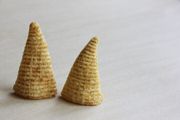 Cone of Corns Snack. Yellow, puffed.