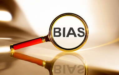 BIAS concept. Magnifier glass with text on white background in sunlight. - obrazy, fototapety, plakaty