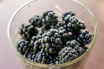 Delicious ripe berry blackberry in glass glass raw food autumn harvest