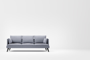 Grey couch with pillows on studio white background.