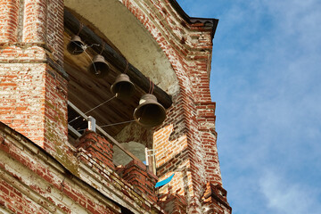 four small brass bells on the bell tower of the old Russian Orthodox Church