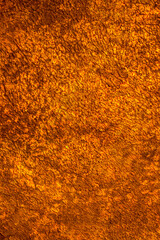 Background wall with abstract spots. Beautiful golden texture with stains, abstract surface background, modern bright painting of walls in trending shades, unusual spotty silver and gold surface.