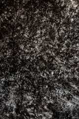 Fototapeta premium Beautiful dark texture abstract wall background, ribbed black surface texture with copy space, unusual gray spotted surface background