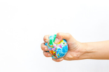 Global stress ball in girl hand on white background, squeeze the world