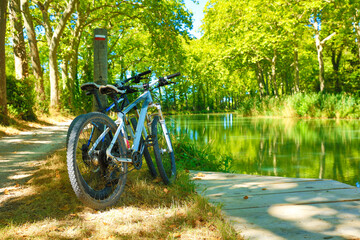 two bikes and river- sport, freedom, tourism concept- Canal du Midi © M.studio
