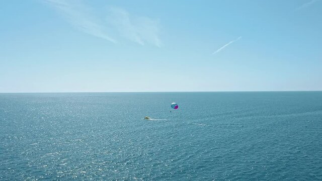 Colorful parasail wing pulled by a boat in the sea water - Alanya, Turkey