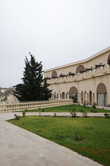Obraz premium Exterior architecture and garden patio design of Turkish carved rock hotel of Cappadocia area, offers panoramic fairy chimney views- Kapadokya, Turkey