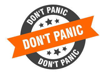Fototapeta premium don't panic sign. round ribbon sticker. isolated tag
