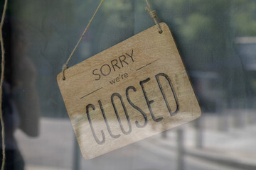 wood sorry we are closed sign board wooden vintage board on windows shop restaurant cafe store signboard