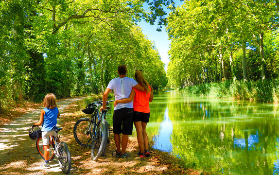 Family with bikes- sport, holiday, family concept France, Canal du Midi