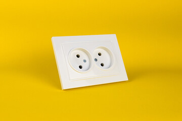 power socket on yellow background