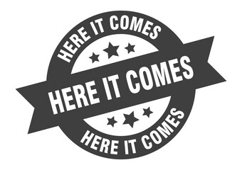 here it comes sign. round ribbon sticker. isolated tag