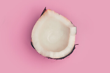 coconut broken on pink background isolate, copy space, layout