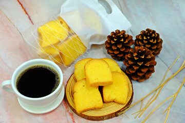 Crispy butter and sugar toasts served with hot black coffee cup surrounded by decorative elements.