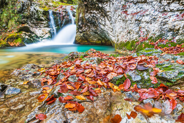 Fototapeta na wymiar Autumn. Explosion of colors on the waterfalls and streams of the Val d'Arzino.