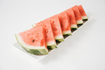 Closeup of fresh watermelon slices on white background.