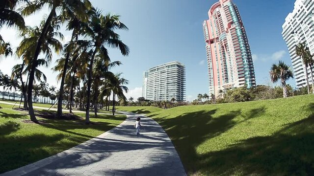 Baby girl playing in south pointe park, Miami. Slow motion