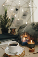 autumn home layout with a candle and a Cup of coffee
