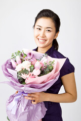 young woman holding bouquet