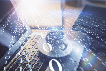 Double exposure of desktop computer and technology theme hologram. Concept of software development.