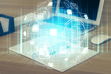 Computer on desktop with social network hologram. Multi exposure. Concept of international people connections.