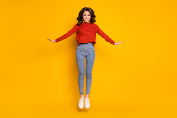 Fototapeta na wymiar Full size photo of positive cheerful girl jump enjoy rest relax weekend wear good look clothes gumshoes isolated over shine color background