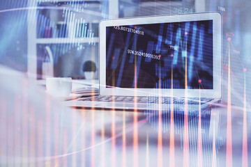 Stock market chart hologram drawn on personal computer background. Multi exposure. Concept of investment.