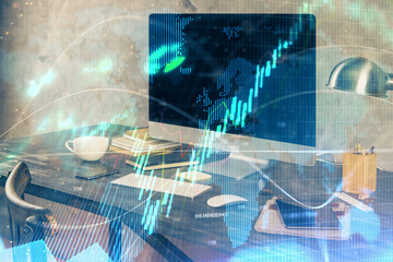 Naklejka premium Financial market graph hologram and personal computer on background. Multi exposure. Concept of forex.