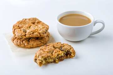 Coffee or tea with milk and oat cookies. Coffee time snack in cafe