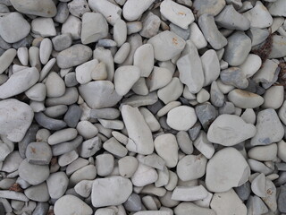 abstract background with round peeble stones on sunny day