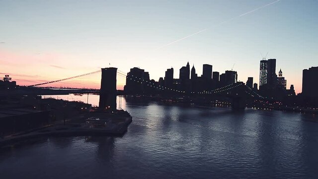 Brooklyn Bridge and Manhattan skyline at dusk from Manhattan Bridge