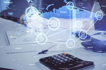 Man's hands working with notes background. Social networking scheme . Mixed media